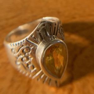 Sterling ring. marked...nice shape..? amber stone. size 9